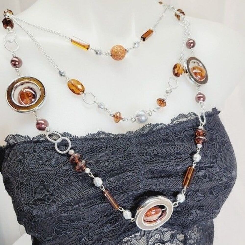 *Contemporary necklace 38" long multi strand orange & silver tone spinning